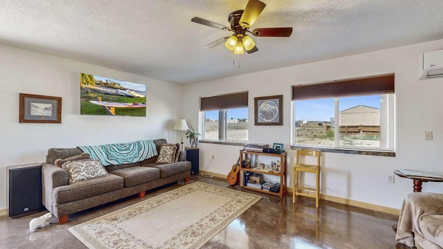 living room with a textured ceiling, concrete floors, and baseboards