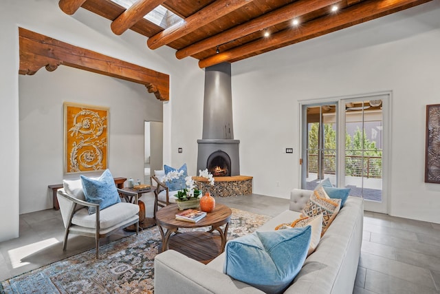 living area featuring beamed ceiling and wooden ceiling