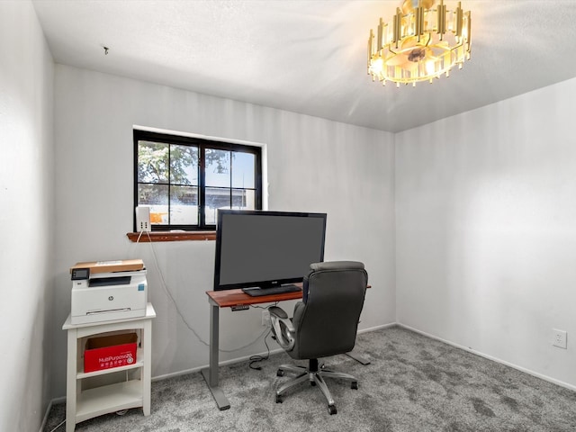 carpeted home office with a chandelier