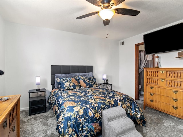 carpeted bedroom with visible vents and ceiling fan