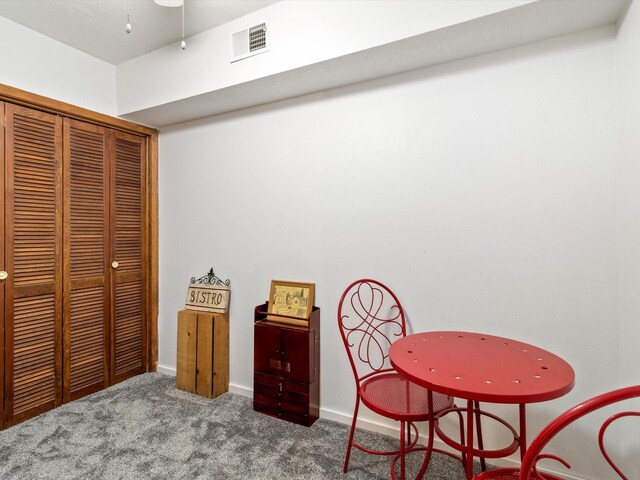 interior space with visible vents, baseboards, and carpet flooring