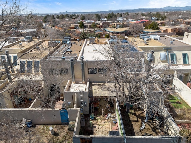 birds eye view of property featuring a mountain view and a residential view