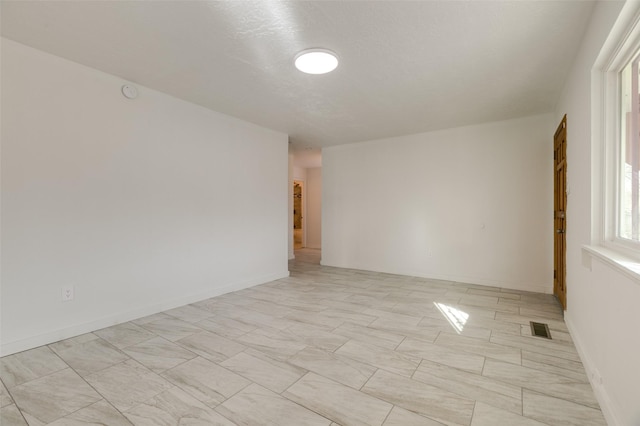 empty room featuring visible vents