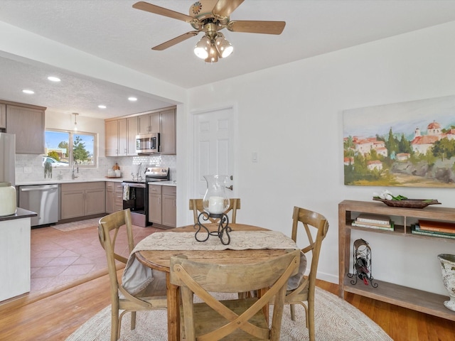 2606 Alamosa Dr, Santa Fe, NM 87505 - dining room featuring ceiling fan, light wood-style flooring, and recessed lighting