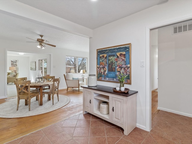 2606 Alamosa Dr, Santa Fe, NM 87505 - dining room featuring light tile patterned floors, baseboards, ceiling fan, and visible vents