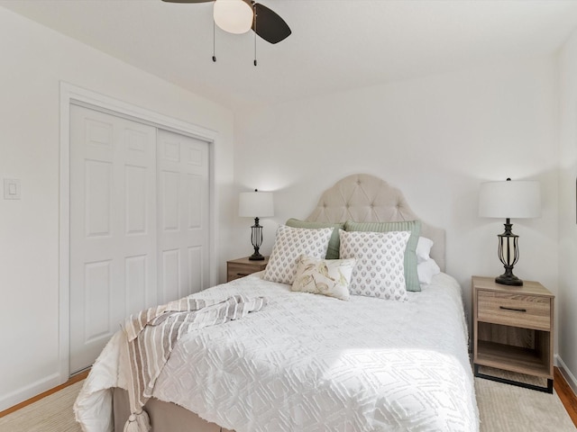 2606 Alamosa Dr, Santa Fe, NM 87505 - bedroom with baseboards, a closet, ceiling fan, and wood finished floors
