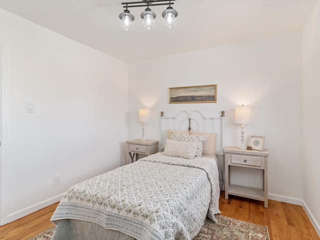 2606 Alamosa Dr, Santa Fe, NM 87505 - bedroom with baseboards and wood finished floors