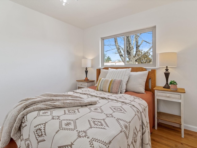 2606 Alamosa Dr, Santa Fe, NM 87505 - bedroom with baseboards and wood finished floors