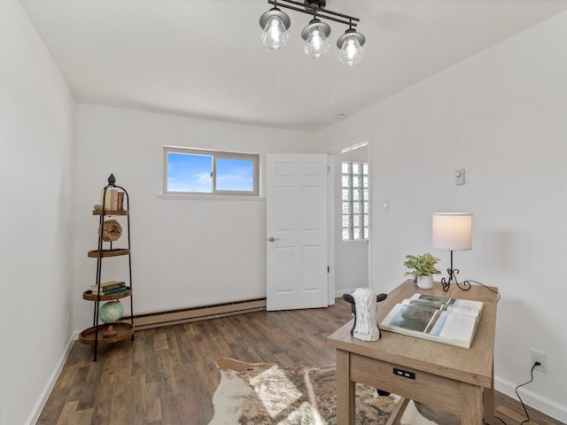 2606 Alamosa Dr, Santa Fe, NM 87505 - home office featuring baseboards, wood finished floors, a baseboard heating unit, and plenty of natural light
