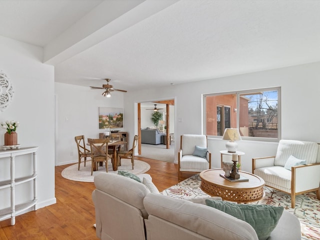 2606 Alamosa Dr, Santa Fe, NM 87505 - living room featuring a ceiling fan, baseboards, and light wood-type flooring