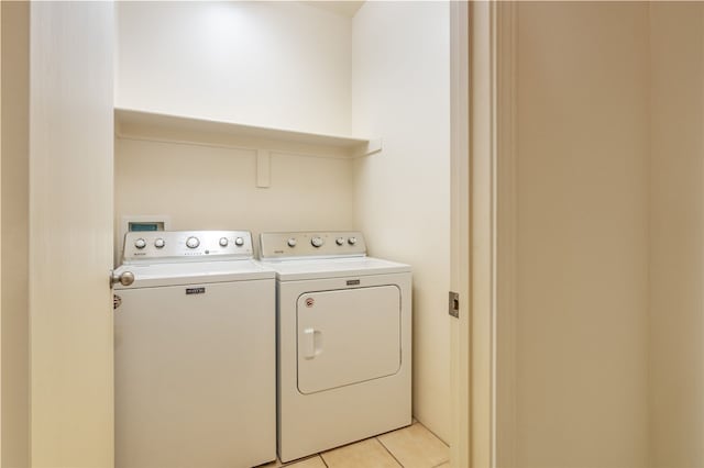9 E Saddleback Mesa, Santa Fe, NM 87508 - laundry area featuring washer and clothes dryer and light tile patterned flooring