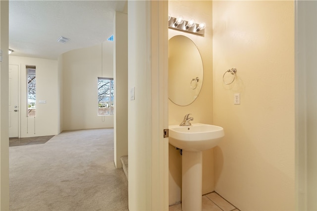 9 E Saddleback Mesa, Santa Fe, NM 87508 - bathroom featuring healthy amount of natural light and a sink