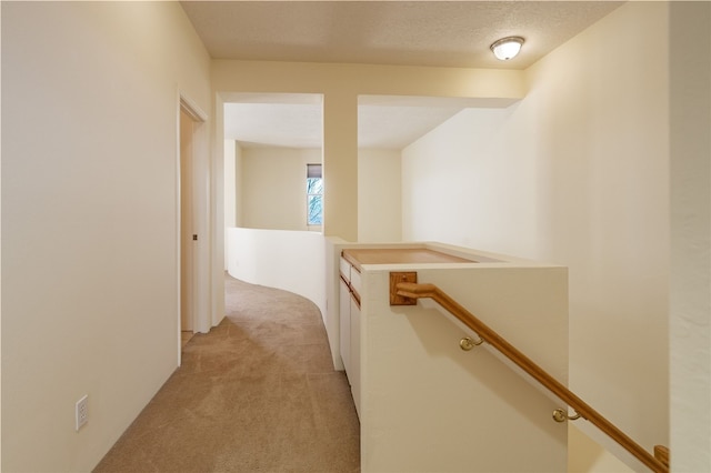 9 E Saddleback Mesa, Santa Fe, NM 87508 - hall featuring an upstairs landing and light carpet