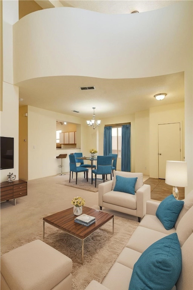 9 E Saddleback Mesa, Santa Fe, NM 87508 - living room featuring a chandelier and carpet