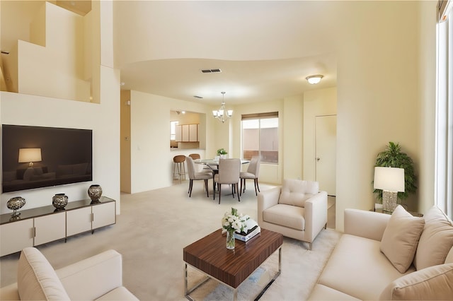 9 E Saddleback Mesa, Santa Fe, NM 87508 - living area with light colored carpet and a chandelier
