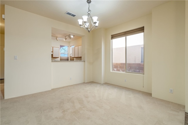 9 E Saddleback Mesa, Santa Fe, NM 87508 - carpeted empty room with a chandelier