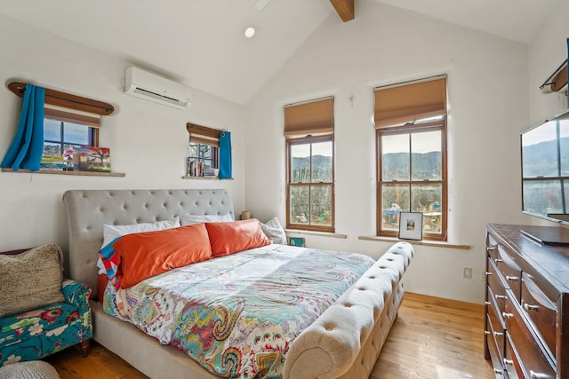 75A Camino Chupadero, Santa Fe, NM 87506 - bedroom featuring vaulted ceiling with beams, light wood-type flooring, and a wall mounted air conditioner