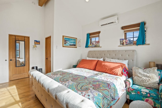 75A Camino Chupadero, Santa Fe, NM 87506 - bedroom featuring high vaulted ceiling, wood finished floors, an AC wall unit, and beam ceiling