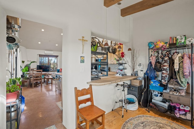 75A Camino Chupadero, Santa Fe, NM 87506 - interior space featuring a towering ceiling, recessed lighting, an AC wall unit, and beamed ceiling