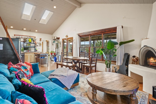 75A Camino Chupadero, Santa Fe, NM 87506 - living room featuring high vaulted ceiling, beam ceiling, light wood finished floors, a skylight, and recessed lighting