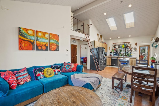75A Camino Chupadero, Santa Fe, NM 87506 - living room featuring beamed ceiling, high vaulted ceiling, a skylight, and recessed lighting