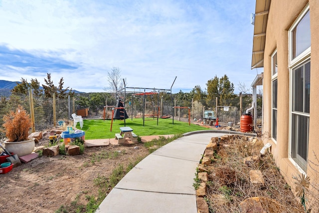 75A Camino Chupadero, Santa Fe, NM 87506 - view of yard featuring a fenced backyard and a playground