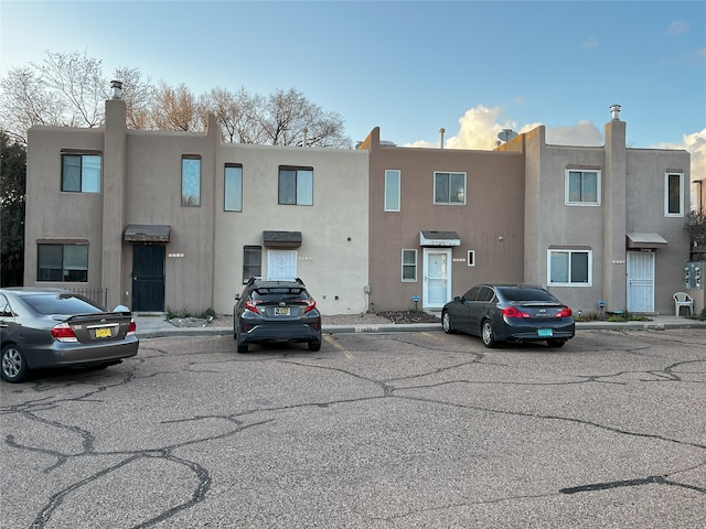 1666 Calle De Oriente Norte, Santa Fe, NM 87507 - view of building exterior featuring uncovered parking