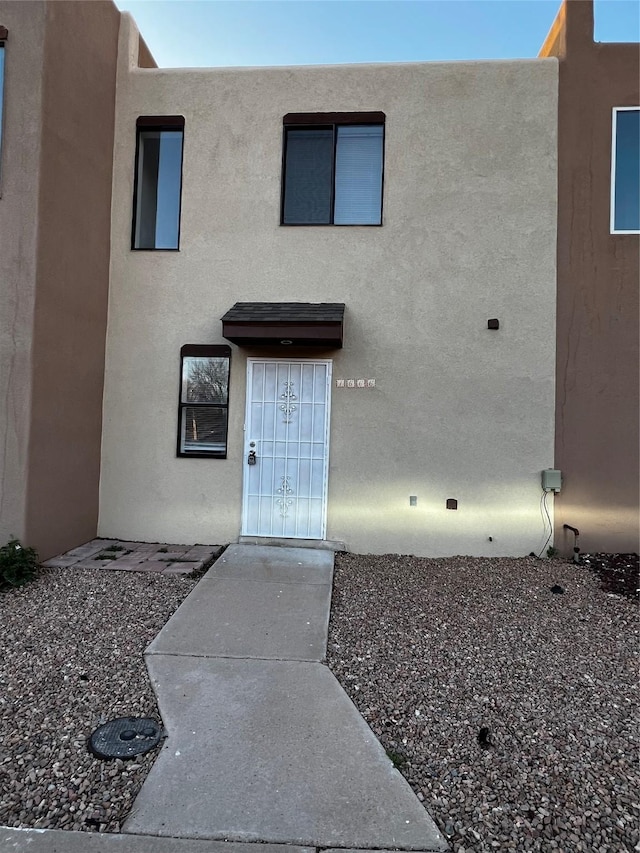 1666 Calle De Oriente Norte, Santa Fe, NM 87507 - view of exterior entry featuring stucco siding