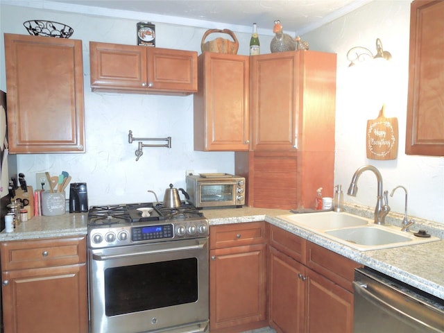 kitchen with light countertops, a sink, and stainless steel appliances
