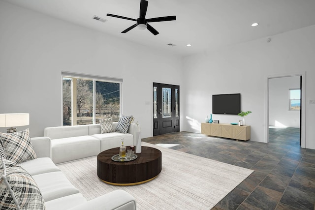 3 Cerro Cir, Lamy, NM 87540 - living room with a high ceiling, stone finish floor, visible vents, ceiling fan, and recessed lighting
