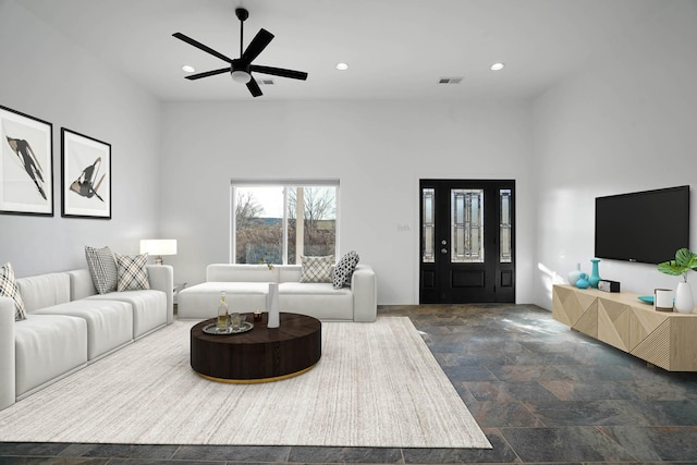 3 Cerro Cir, Lamy, NM 87540 - living room with visible vents, stone finish floor, recessed lighting, and a ceiling fan