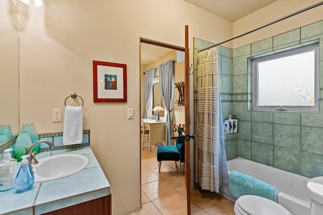 full bathroom featuring toilet, vanity, tile patterned floors, and shower / bathtub combination with curtain
