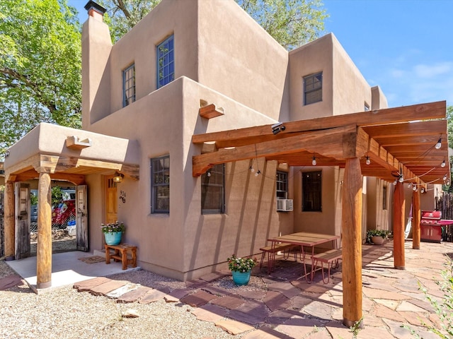 936 Dunlap, Santa Fe, NM 87501 - rear view of house with a patio area, stucco siding, a chimney, and cooling unit