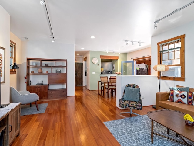 936 Dunlap, Santa Fe, NM 87501 - living area with track lighting, light wood-style floors, and cooling unit