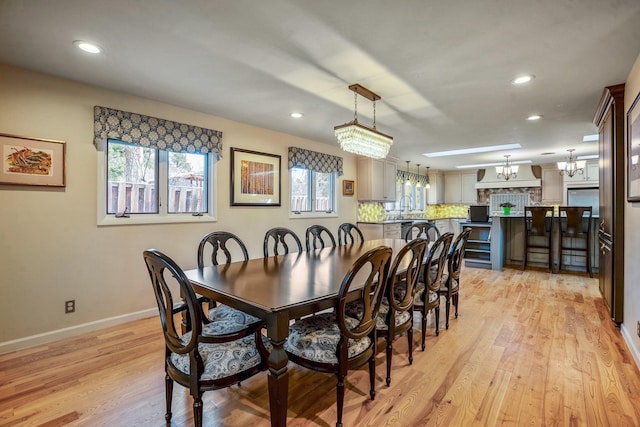126 Andanada, Los Alamos, NM 87544 - dining room featuring a chandelier, light wood-style floors, baseboards, and recessed lighting