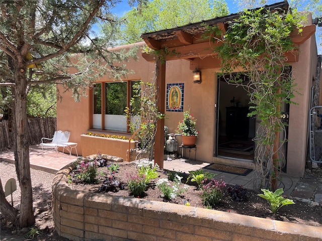 1155 E Alameda, Santa Fe, NM 87501 - view of front of property with stucco siding and a patio area