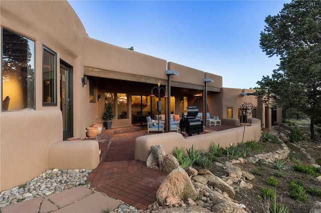 6 Overlook Rd, Santa Fe, NM 87505 - rear view of property featuring stucco siding and a patio