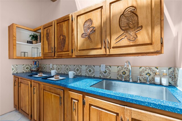 6 Overlook Rd, Santa Fe, NM 87505 - kitchen with dark countertops, brown cabinetry, and a sink