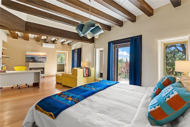 6 Overlook Rd, Santa Fe, NM 87505 - bedroom with multiple windows, wood finished floors, beam ceiling, and access to outside