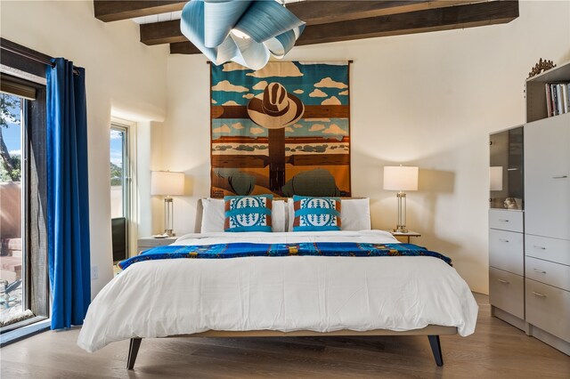 6 Overlook Rd, Santa Fe, NM 87505 - bedroom with wood finished floors and beam ceiling