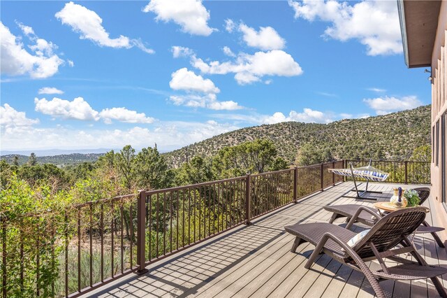6 Overlook Rd, Santa Fe, NM 87505 - deck with a wooded view and a mountain view