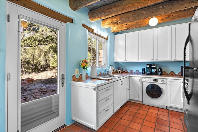 6 Overlook Rd, Santa Fe, NM 87505 - washroom with dark tile patterned flooring, washer / clothes dryer, a sink, and laundry area