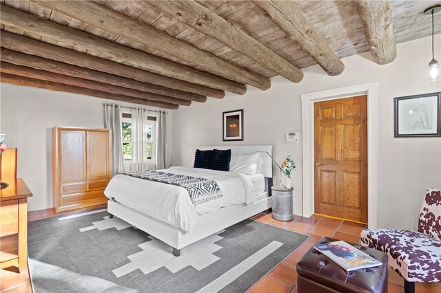 6 Overlook Rd, Santa Fe, NM 87505 - bedroom featuring tile patterned floors, wood ceiling, and beam ceiling