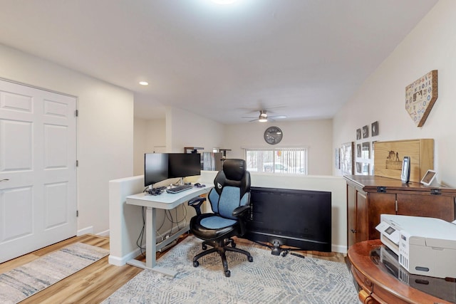 home office featuring baseboards, wood finished floors, recessed lighting, and a ceiling fan