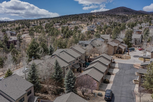 birds eye view of property featuring a mountain view and a residential view