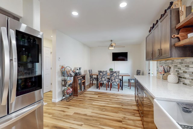 kitchen featuring backsplash, a ceiling fan, open shelves, light wood-style flooring, and smart refrigerator