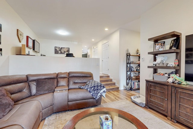 living room featuring light wood-style flooring and recessed lighting