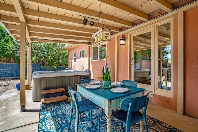 908 Rio Vista St, Santa Fe, NM 87501 - view of patio featuring outdoor dining space, fence, and a hot tub