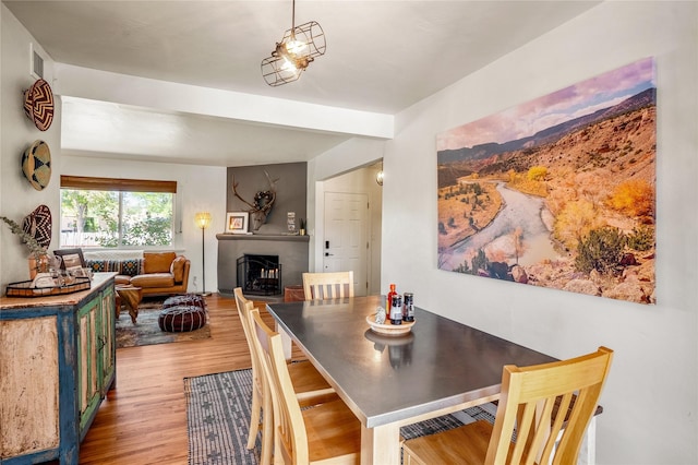 908 Rio Vista St, Santa Fe, NM 87501 - dining room featuring a fireplace and wood finished floors