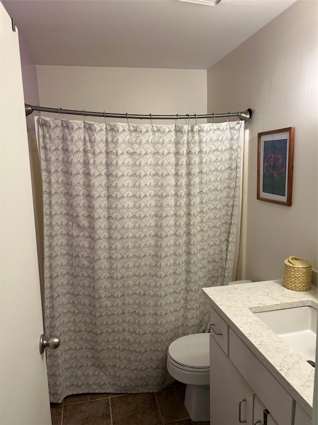 941 Calle Mejia Unit 319, Santa Fe, NM 87501 - full bathroom with a shower with curtain, toilet, vanity, and tile patterned floors